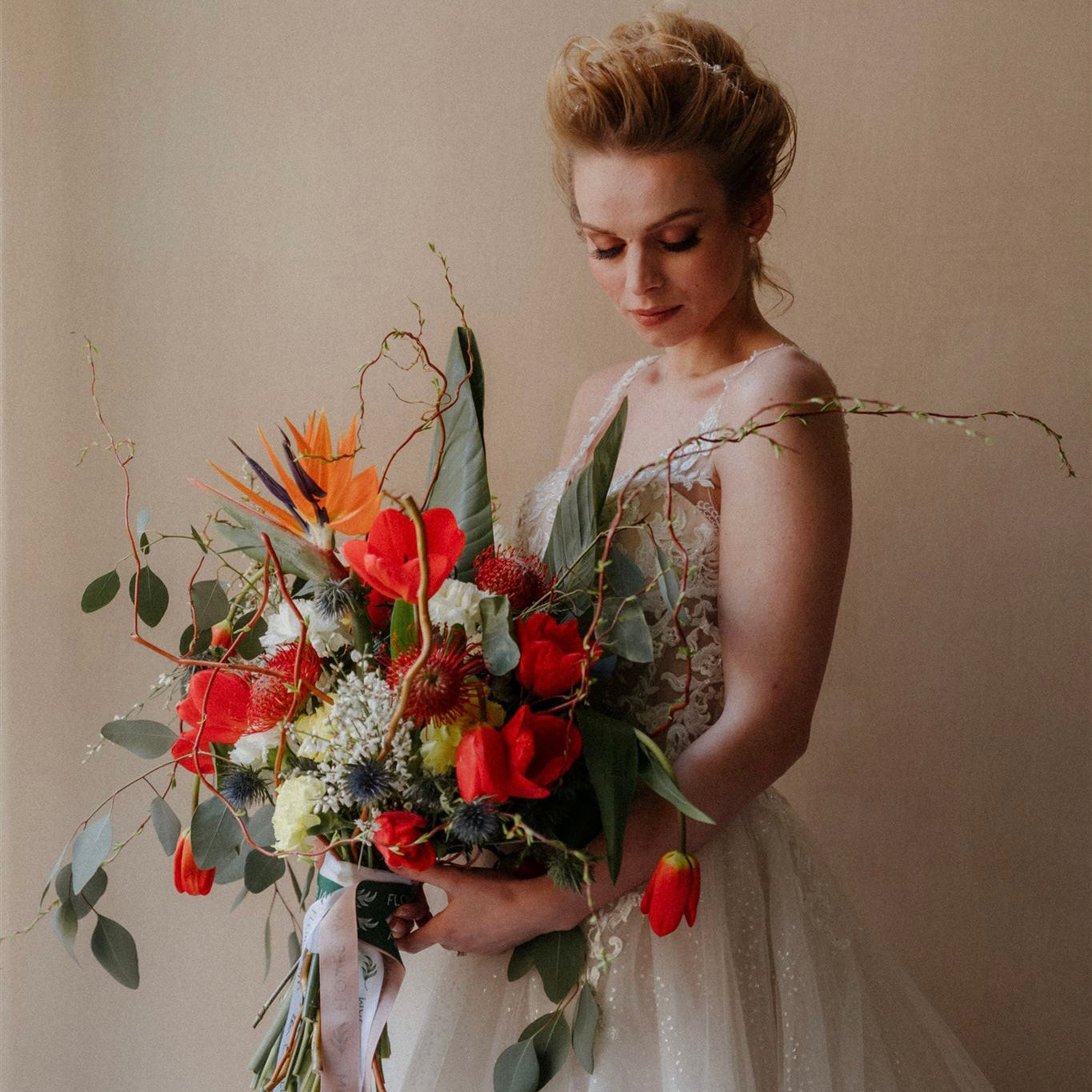 Exotic wedding bouquet with red tulips, bird of paradise,eucaliptus and white carnations in Genova.Order wedding bouquet in Genova.Wedding bouquet in Liguria in Genova and French Riviera.Unique Bride exotic bouquet.Weddin arrangement.Wedding decor.Wedding