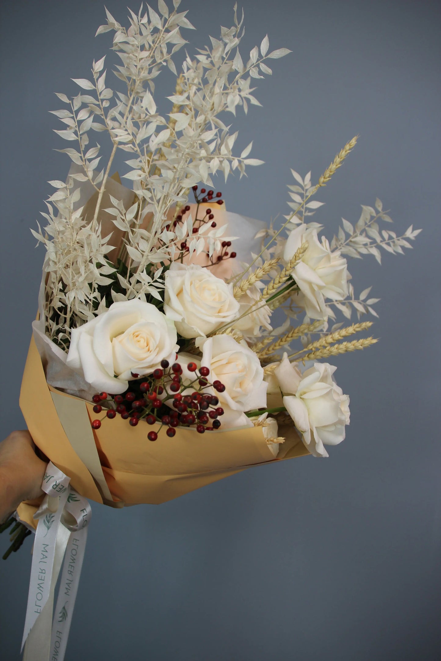 flower arrangement out of red, orange and white flowers