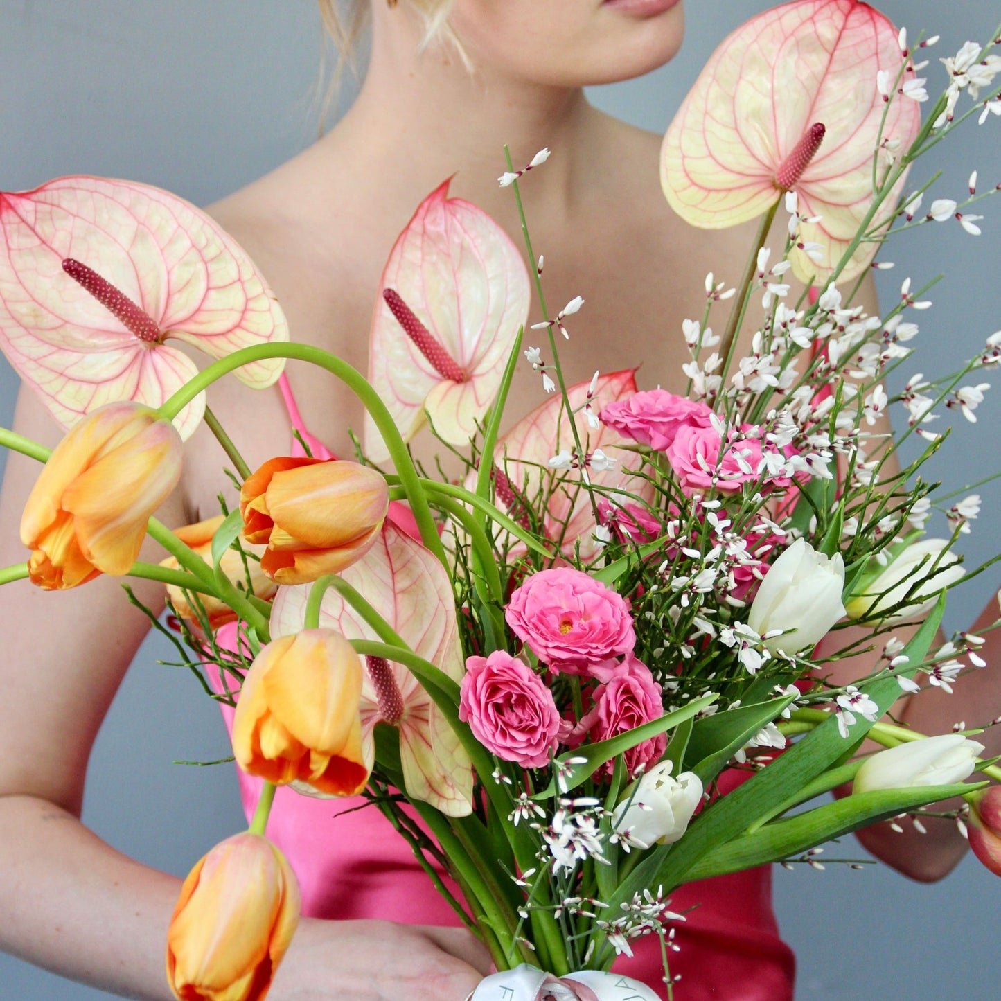 White tulips with lady in a pink dress
