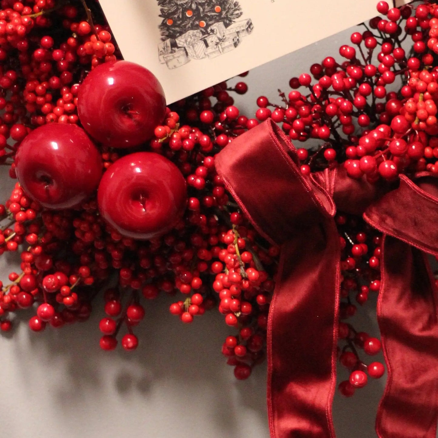 Red Christmas wreath with beads and ribbons