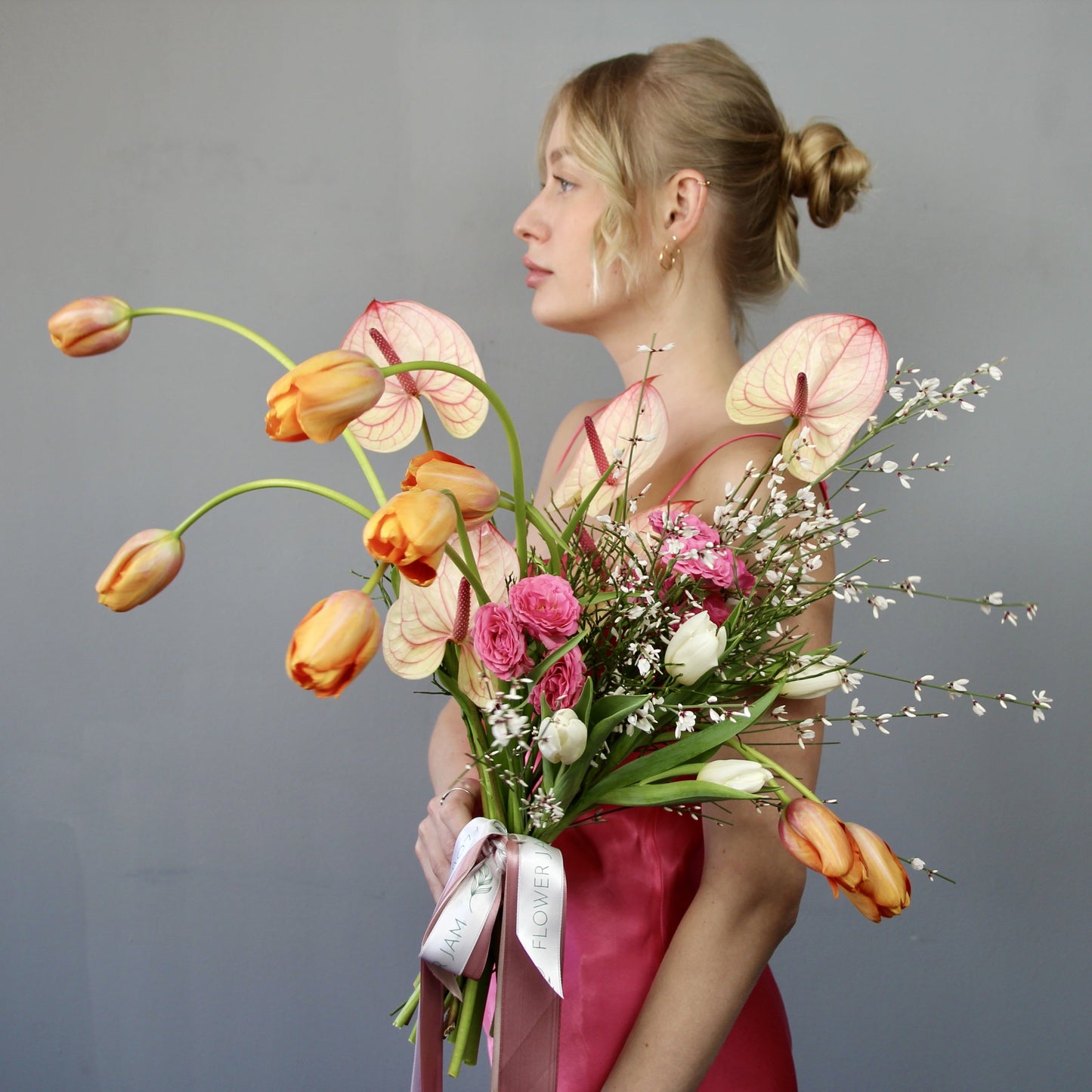 tulips flowers with lady in a pink dress i italy