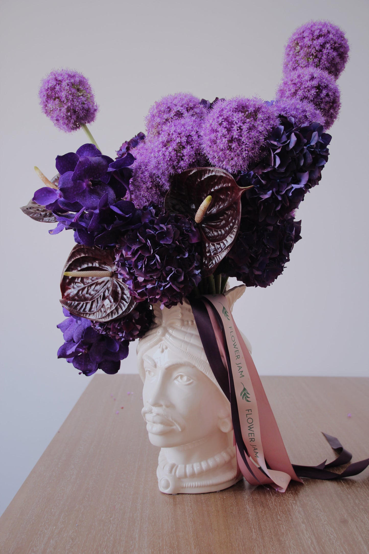 purple flowers in a vase head italian
