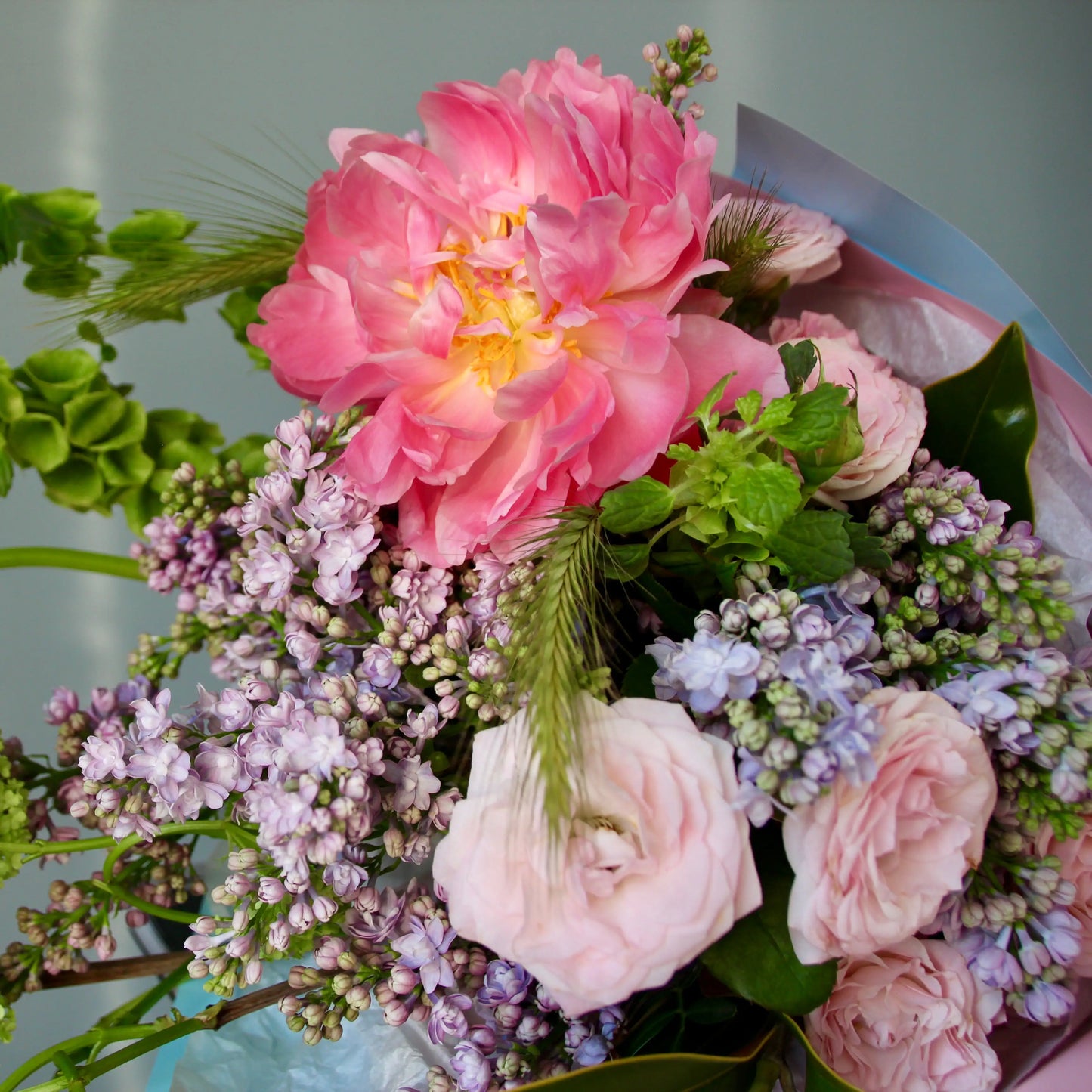 bouquet of pink flowers and greenery
