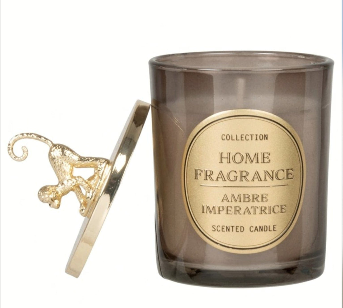 Home fragrance candle with gold label and decorative lid on a white background candle