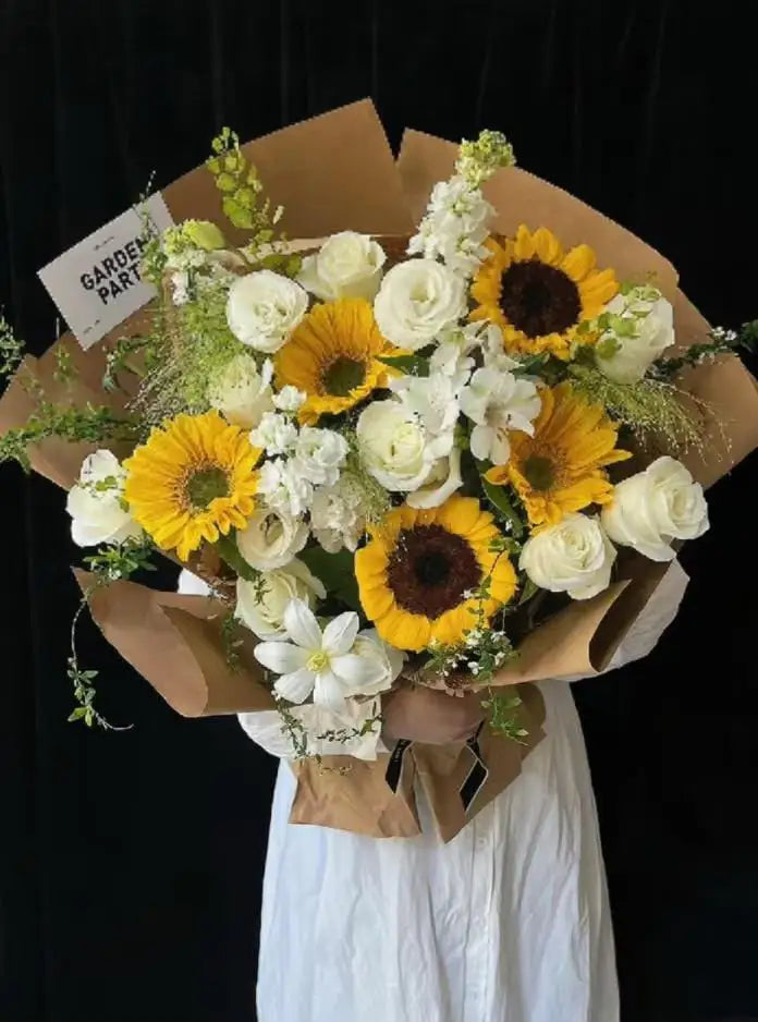 Rustic sunflower bouquet with white flowers on a black background