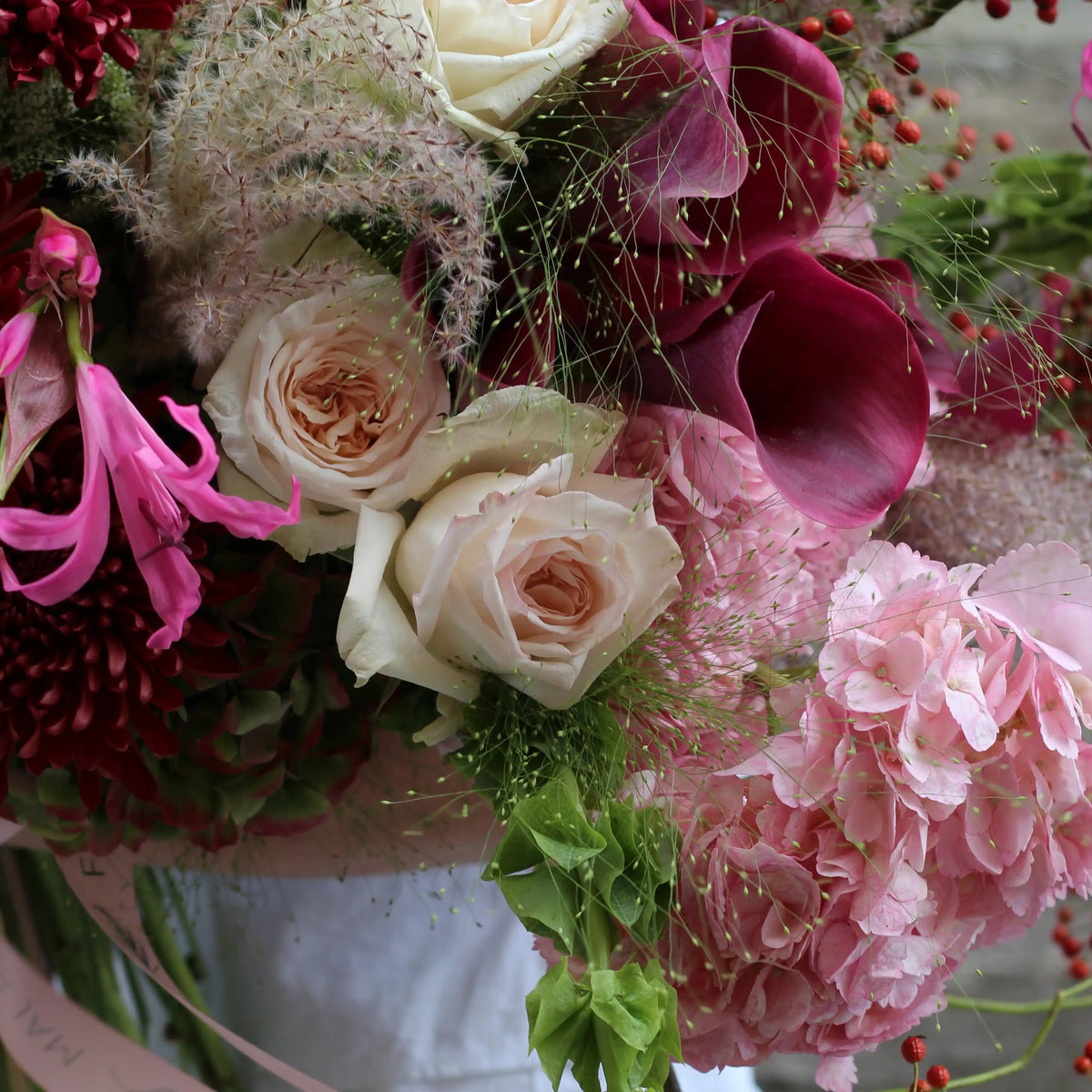 Pink hydrangea, pink callas and white roses and some goodies.
