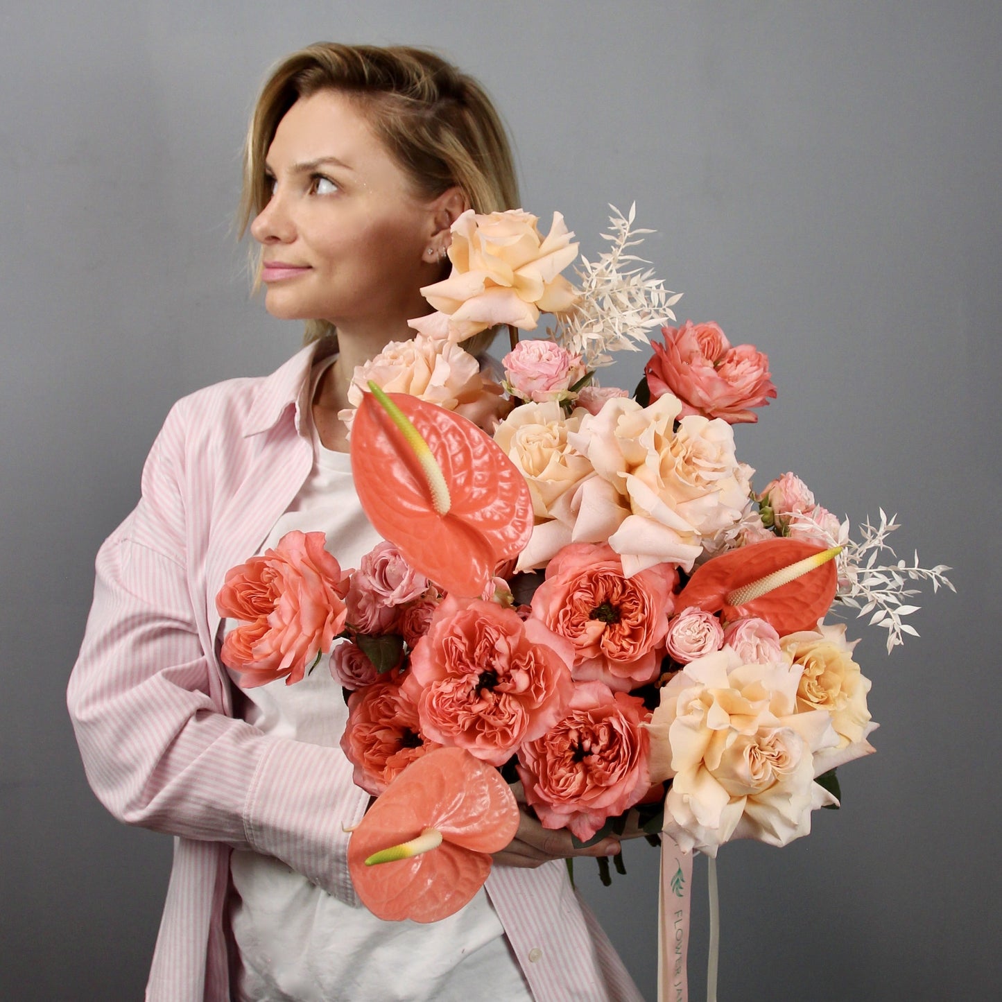 girl with peach color roses bouquet in Genva Bouquet of Flowers