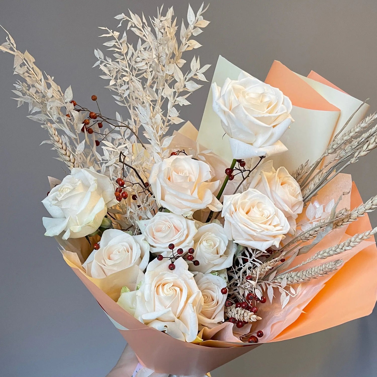 flower arrangement out of red, orange and white flowers