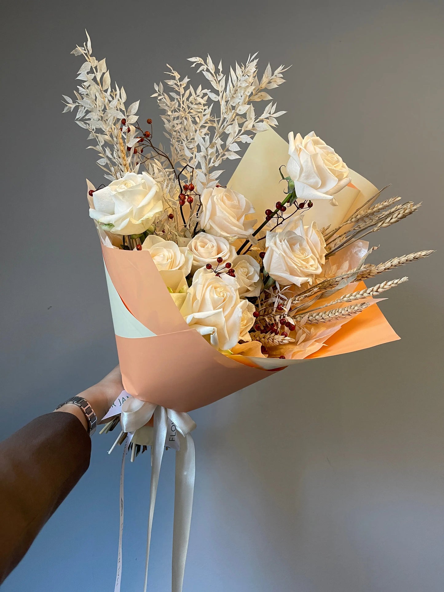 flower arrangement out of red, orange and white flowers