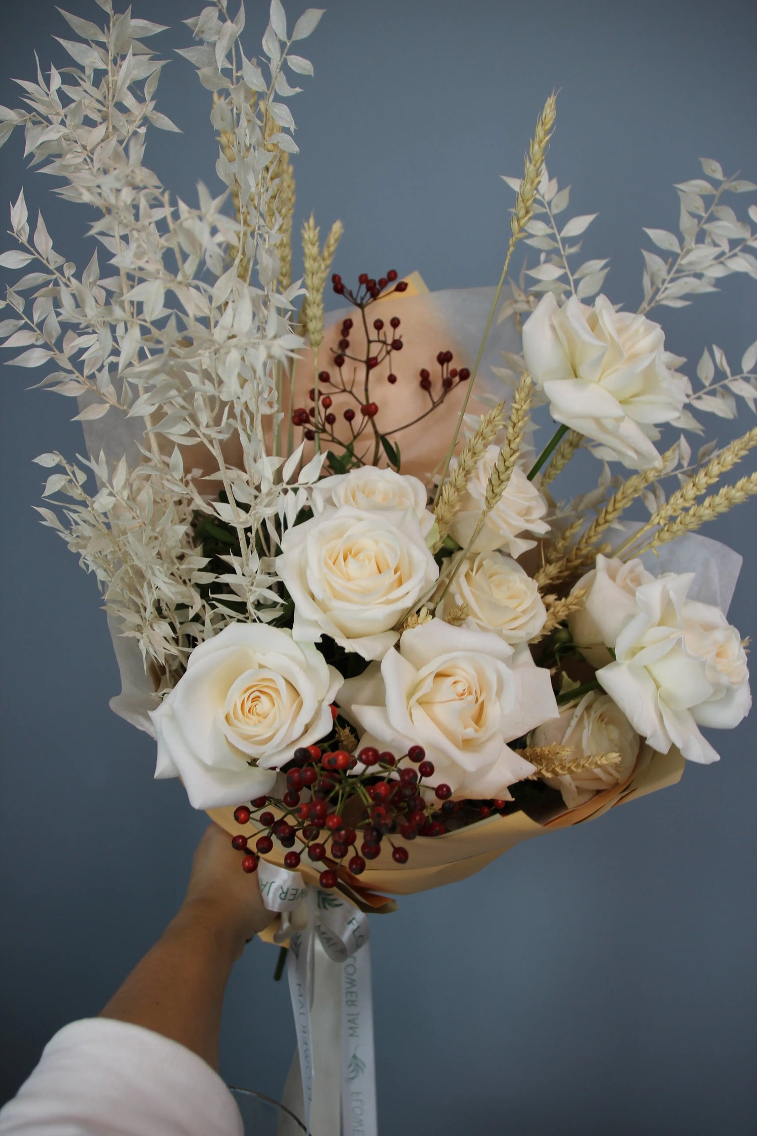 flower arrangement out of red, orange and white flowers