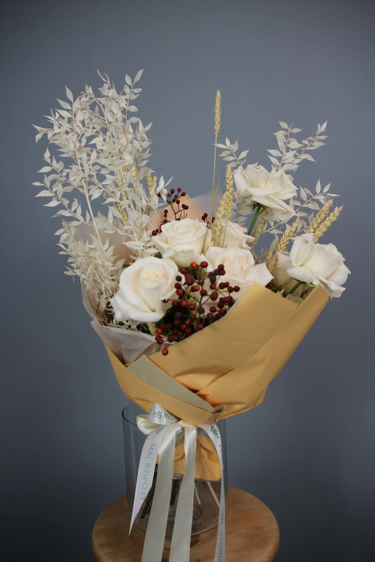 flower arrangement out of red, orange and white flowers