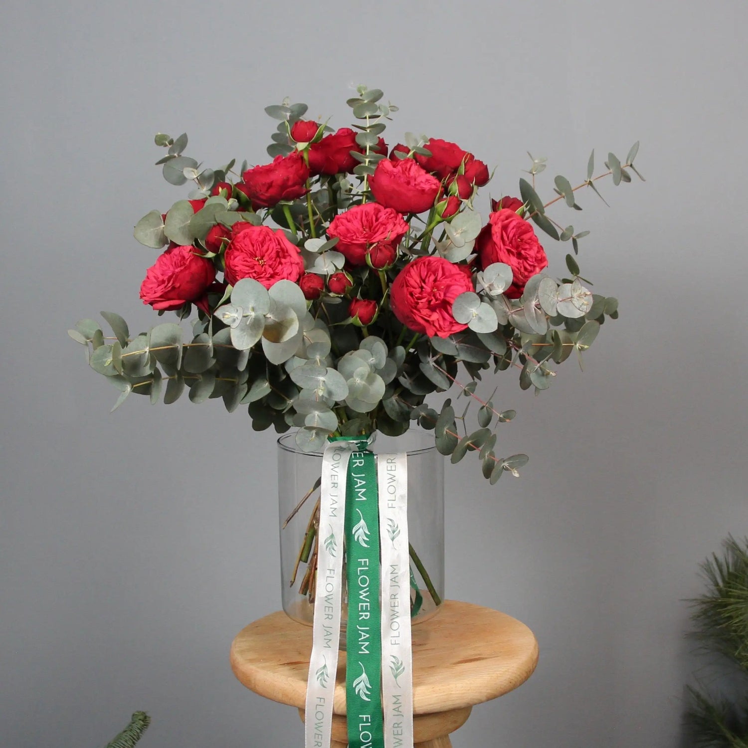 a bouquet of red english garden roses and eucalipt