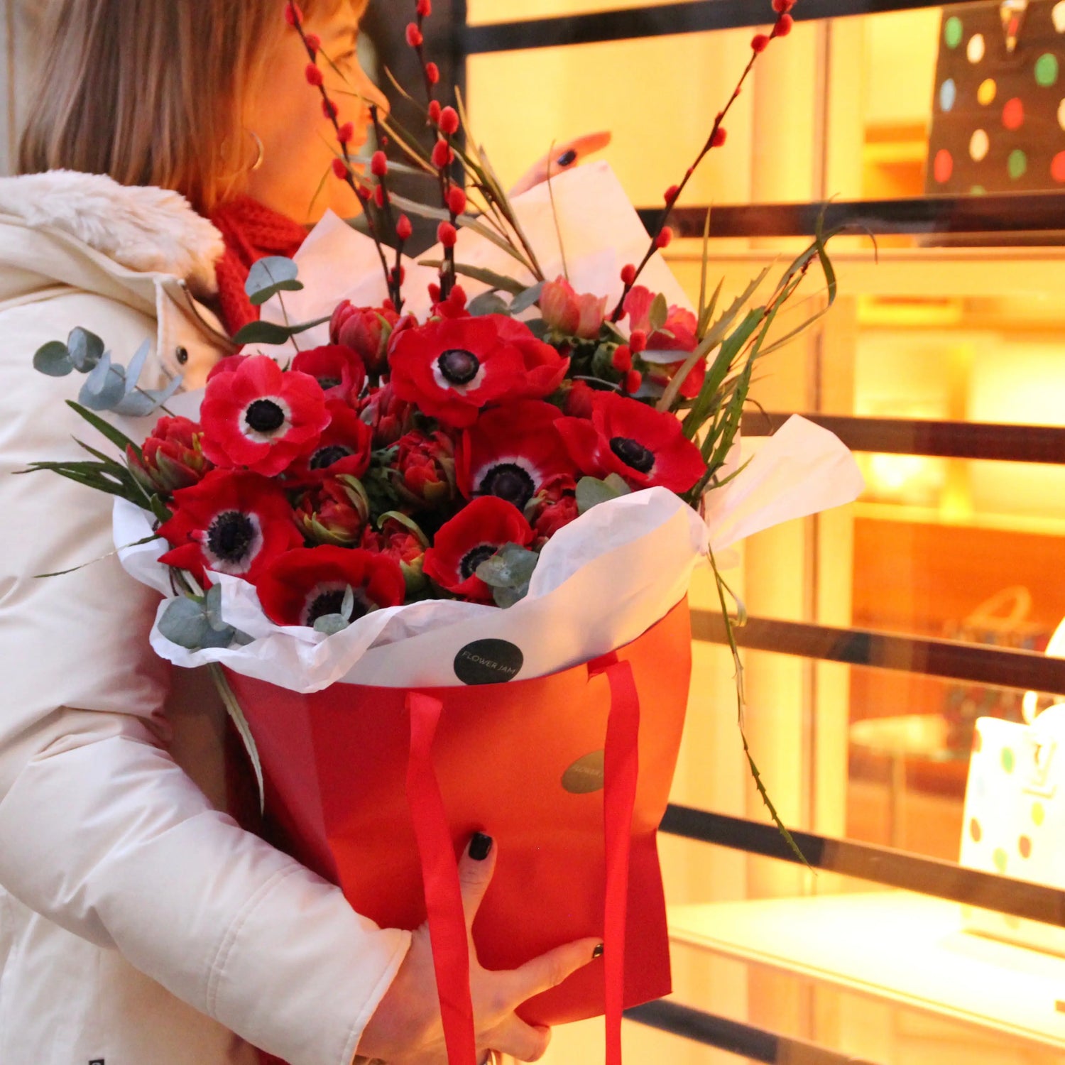 red anemone bouquet in a red box