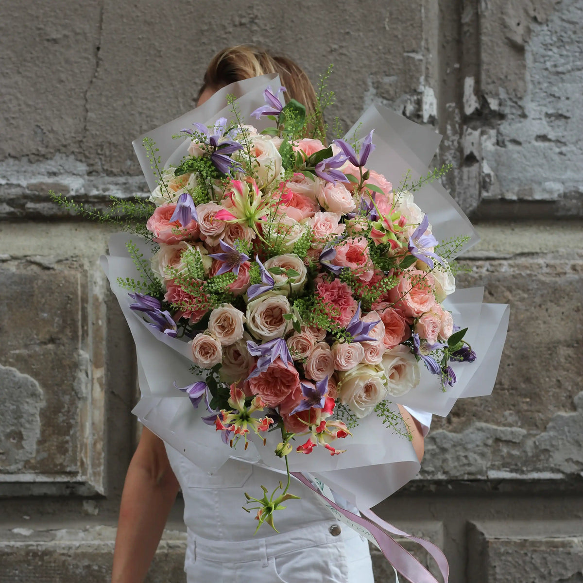 Bouquet of pink garden roses, white garden roses, climatis, gloriosa, dianthus and green goodies.