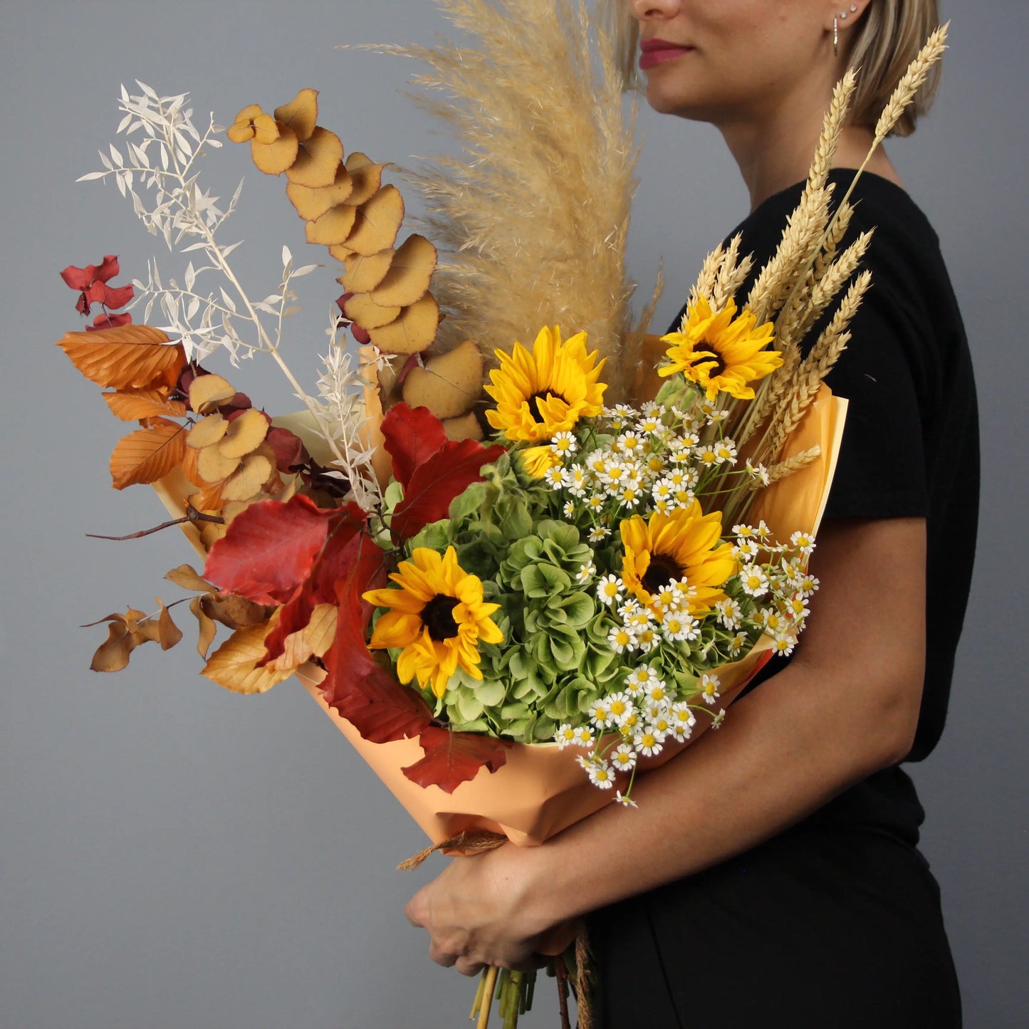 colorful summer bouquet wih brown, yellow, red and white flowers