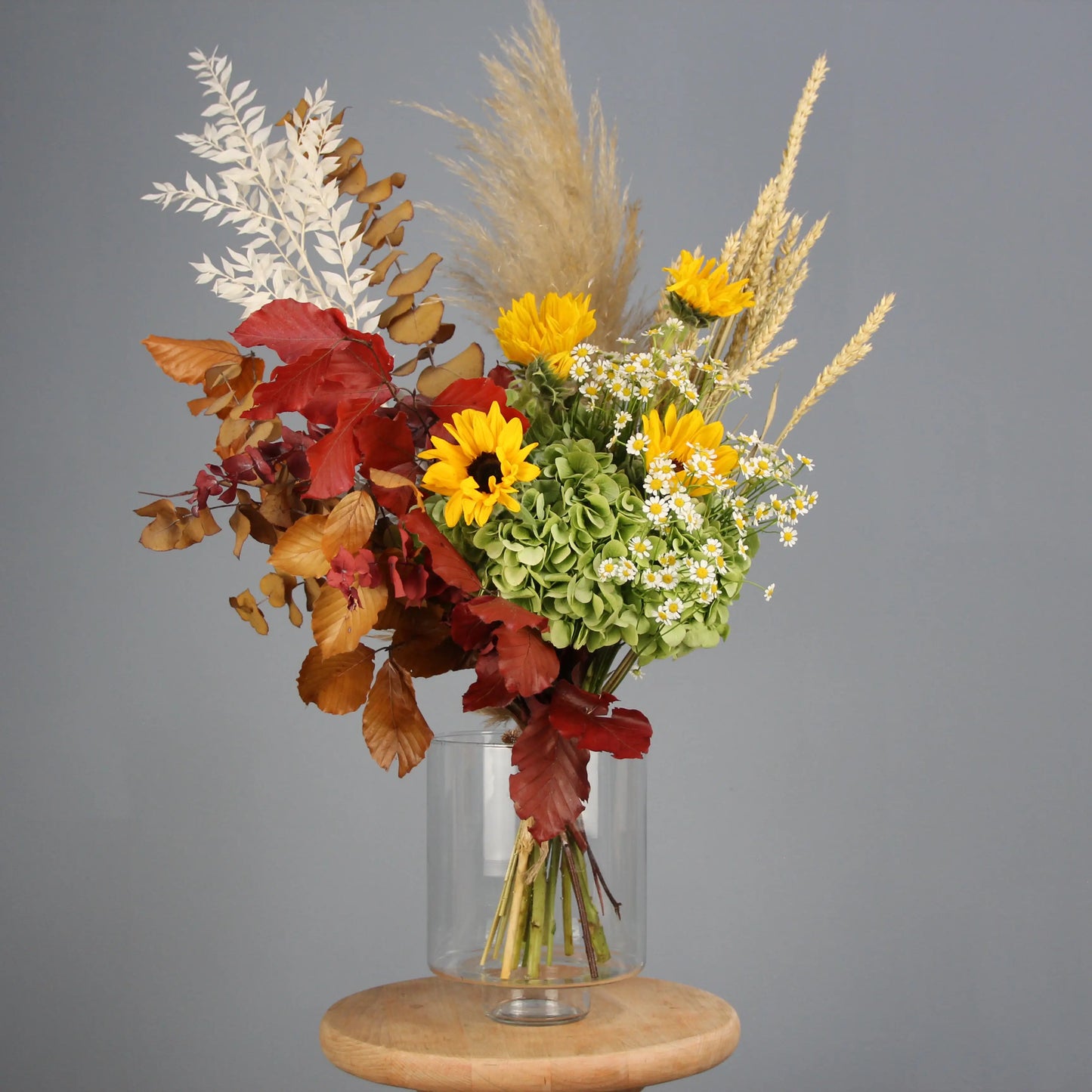 colorful summer bouquet wih brown, yellow, red and white flowers