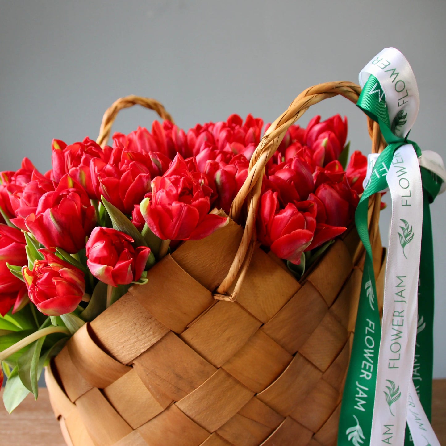 basket with red tulips