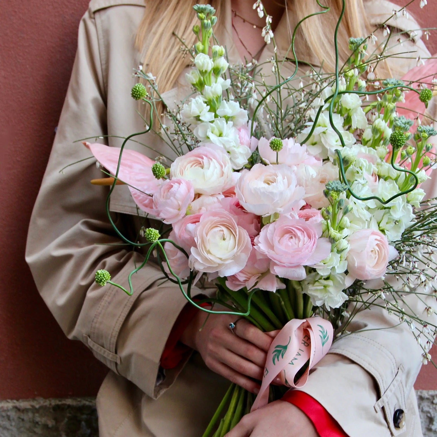 Bouquet of beautiful Ranunculus, Matthiola , Allium , Anthurium and blossom branches.