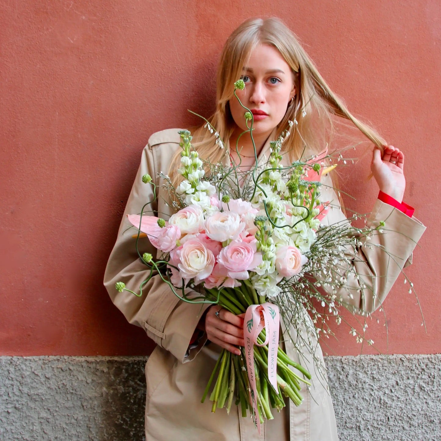Bouquet of beautiful Ranunculus, Matthiola , Allium , Anthurium and blossom branches.
