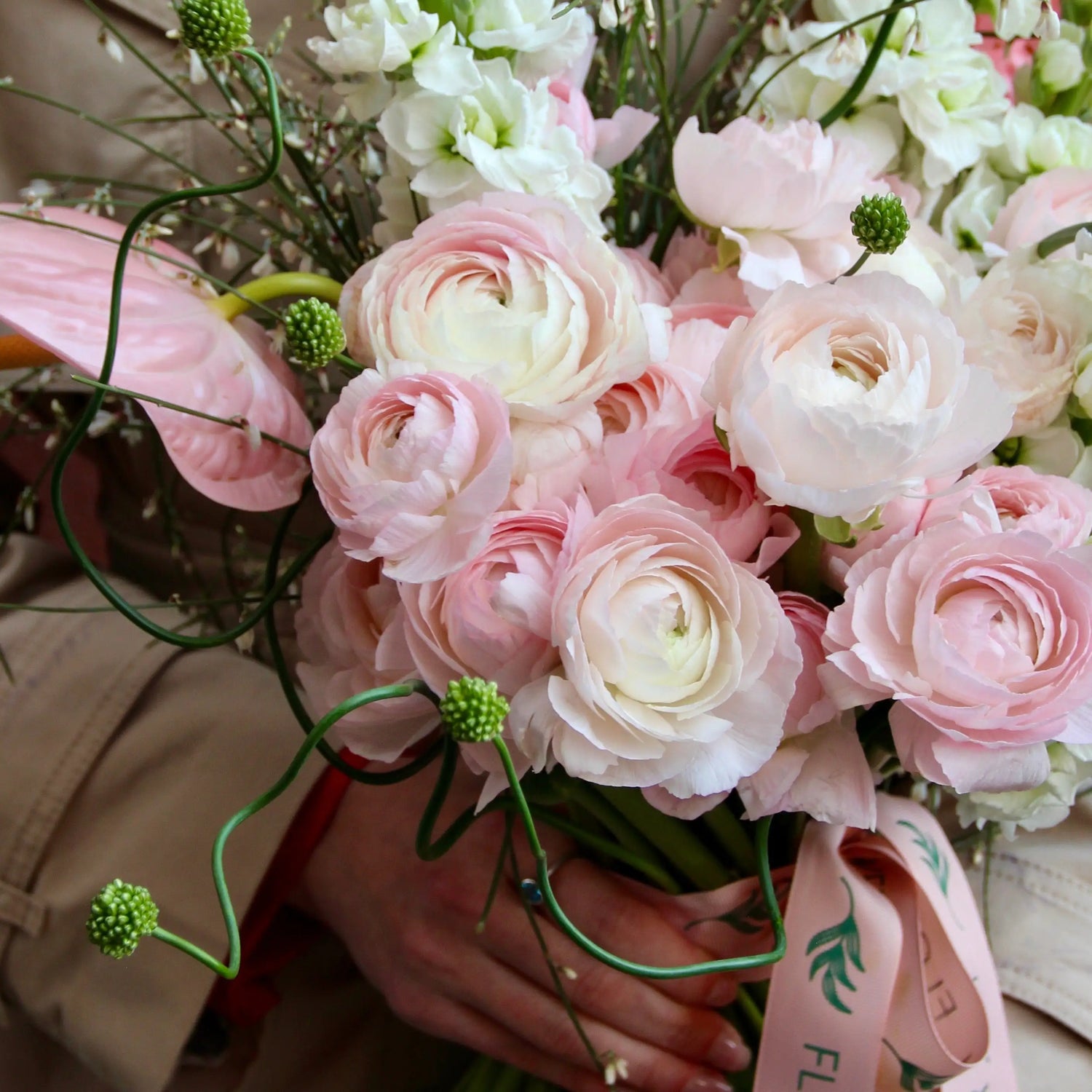 Bouquet of beautiful Ranunculus, Matthiola , Allium , Anthurium and blossom branches.