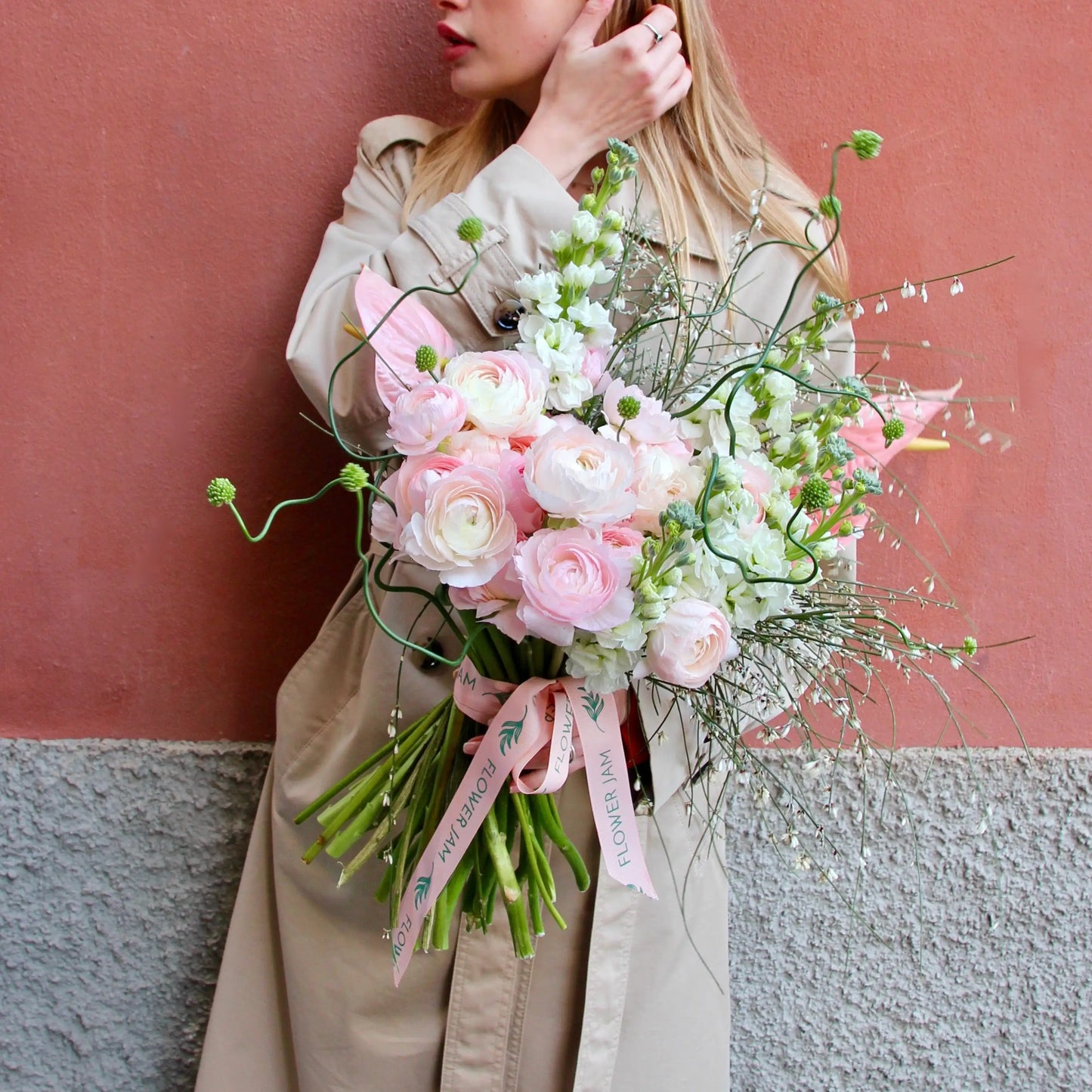 Bouquet of beautiful Ranunculus, Matthiola , Allium , Anthurium and blossom branches.