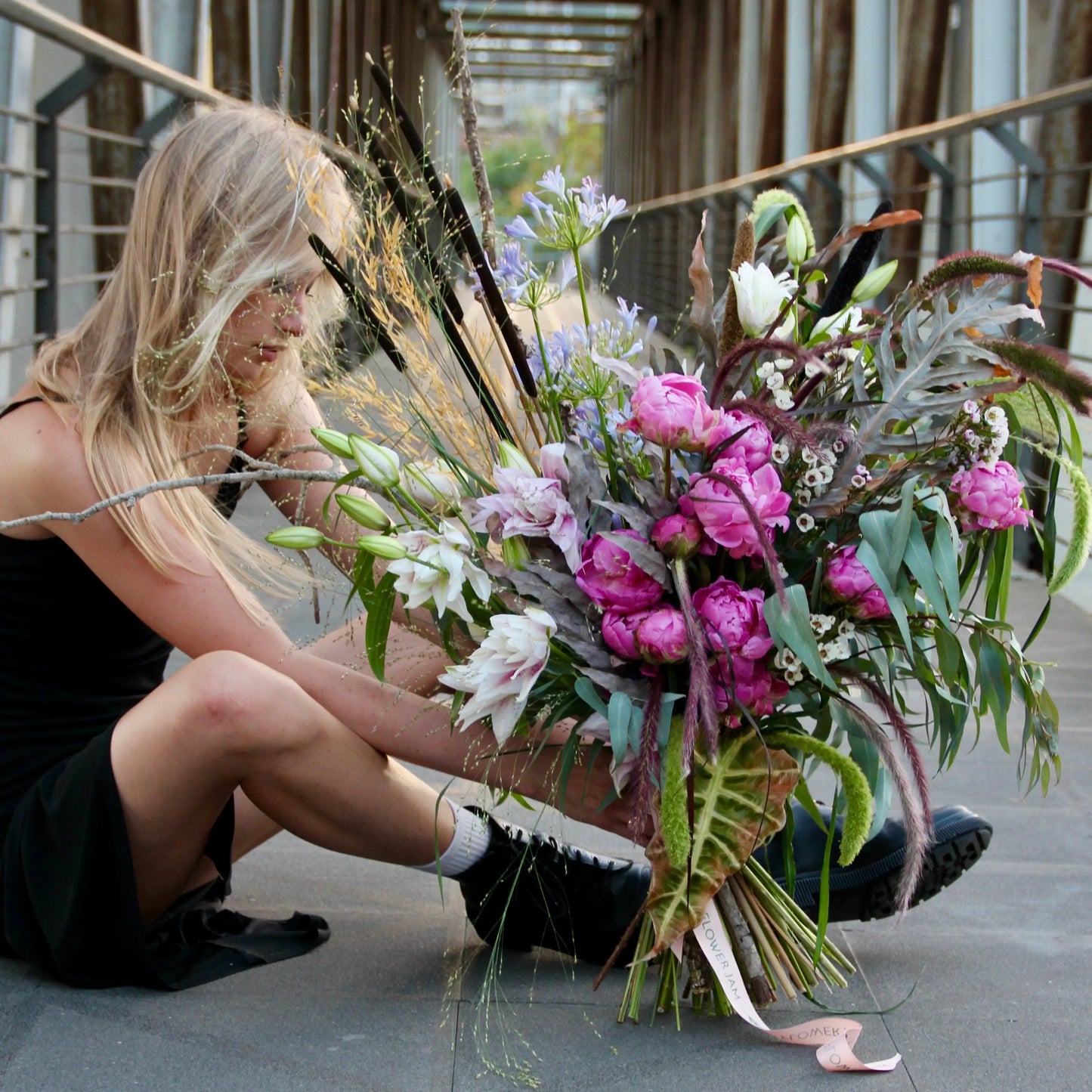 big bouquet with white an pink flowers with a lot of greenery