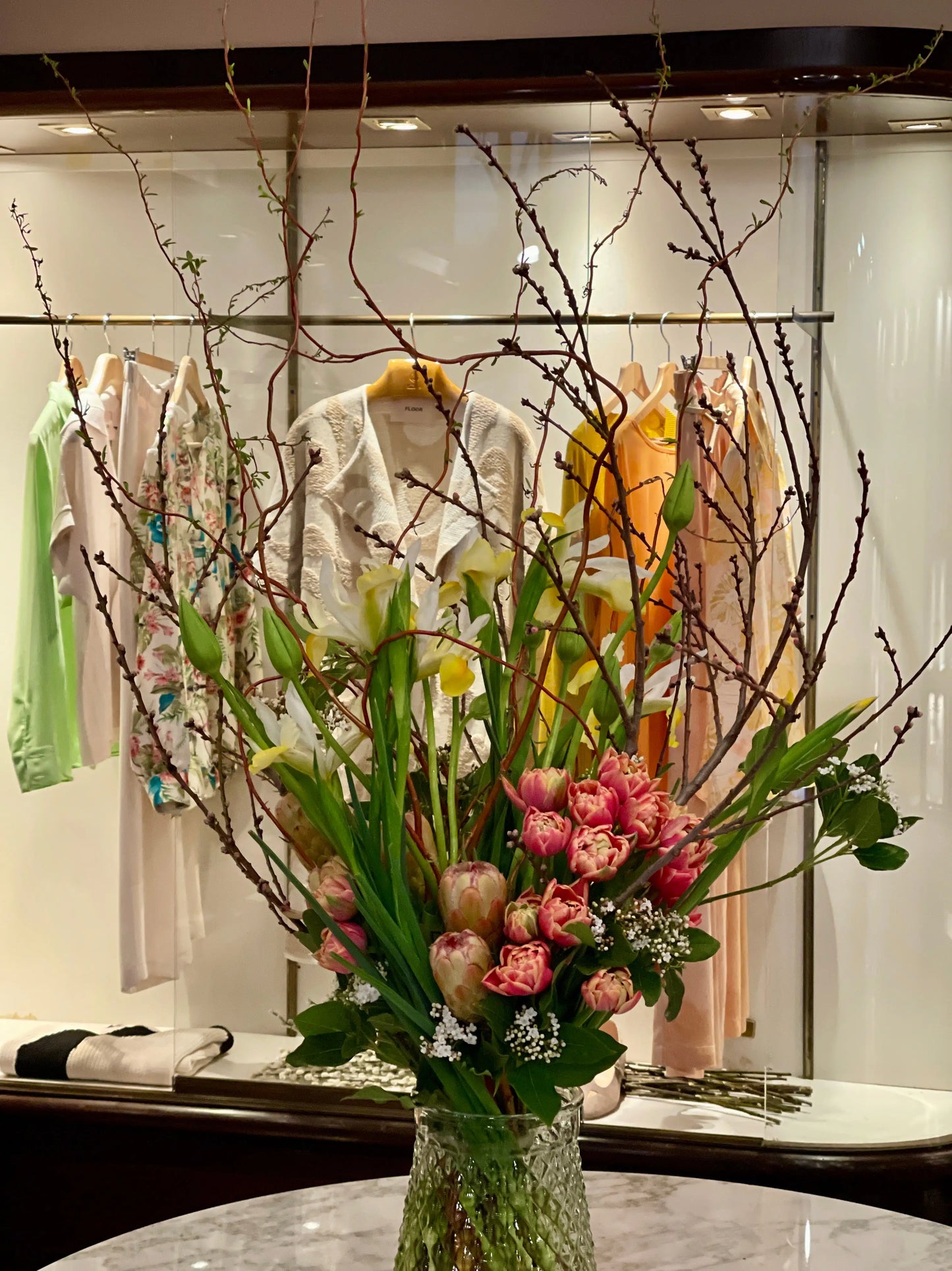 interior arrangement of pink flowres and greenery