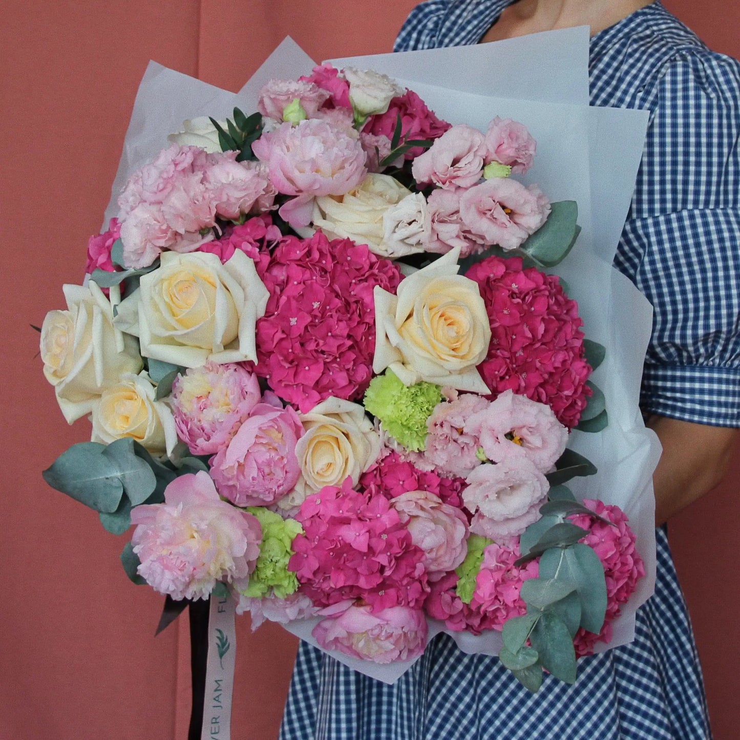 bouquet of pink peonies, pink hortencia, yellow roses and eucalipt