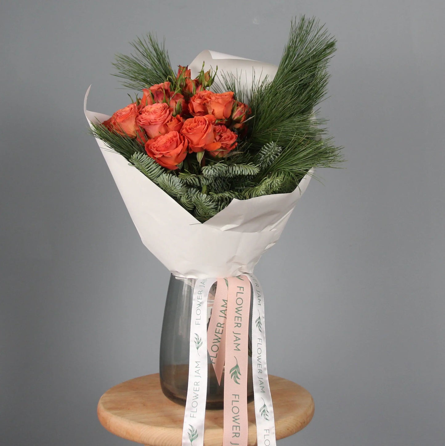 Orange roses and spruce branches bouquet  Bouquet of Flowers