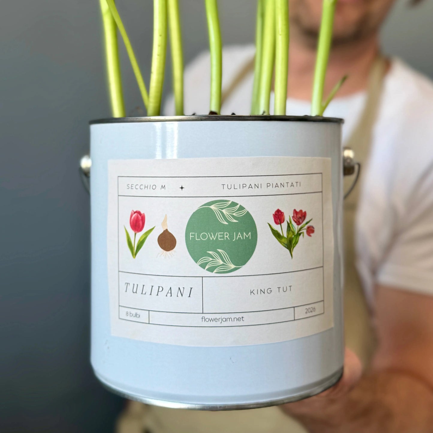 Paint can repurposed as a flower pot
