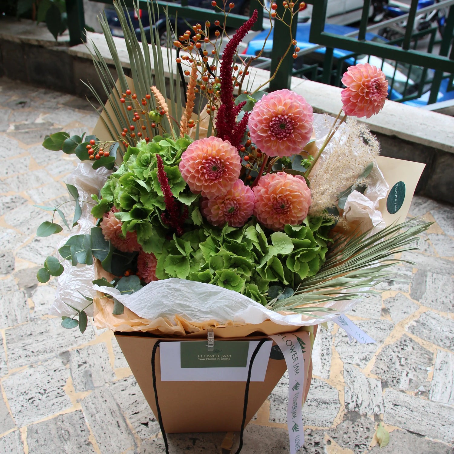 dahlia bouquet and greenery in a box