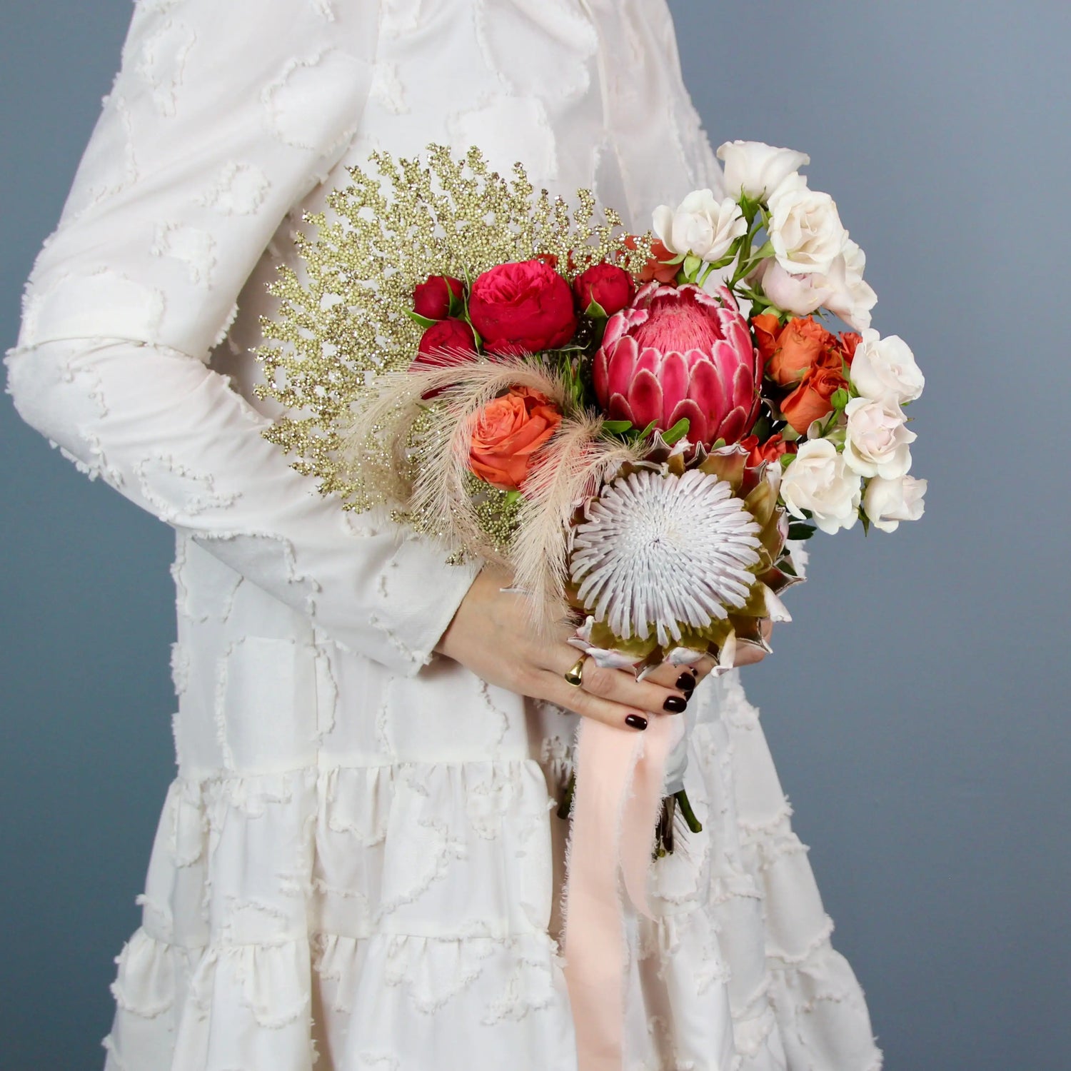 flower arrangement out of red, orange and white flowers