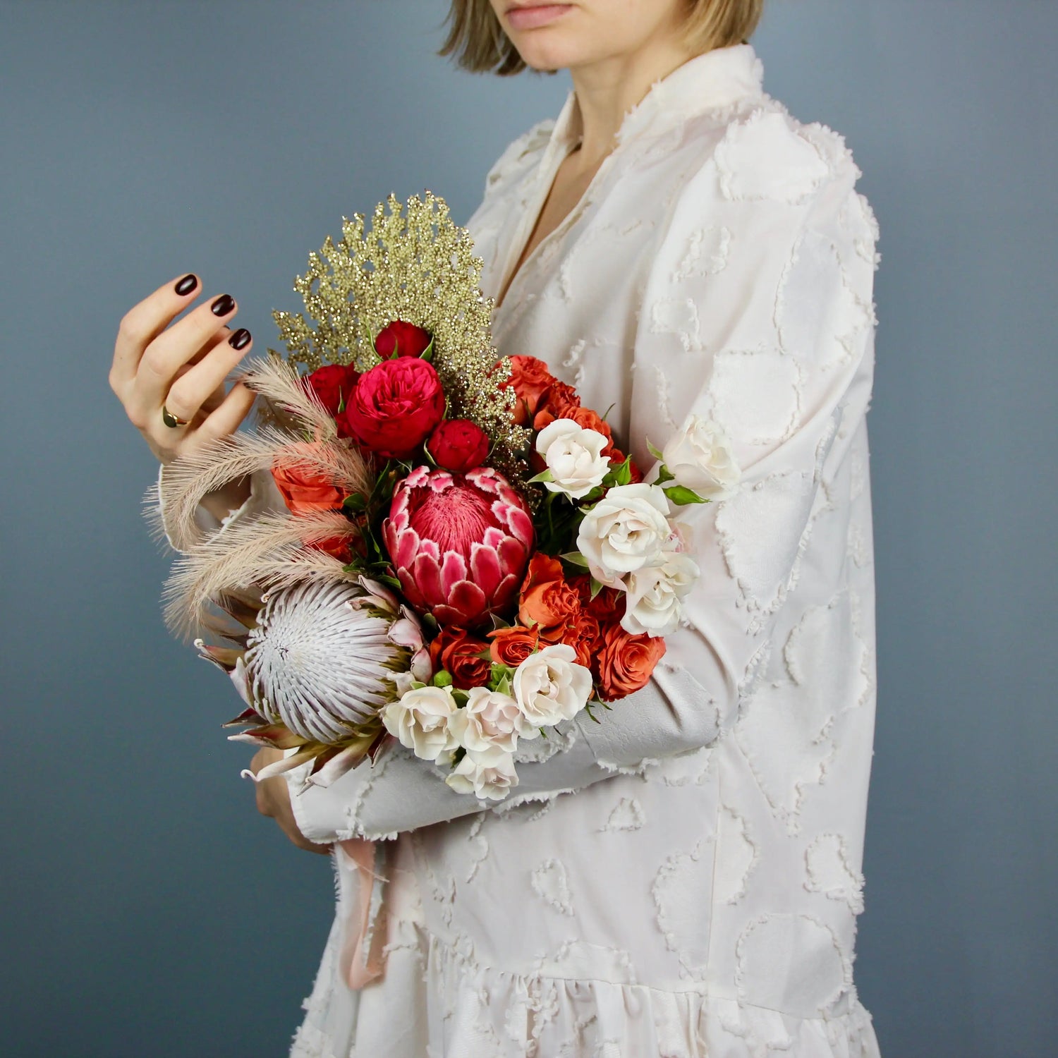 flower arrangement out of red, orange and white flowers