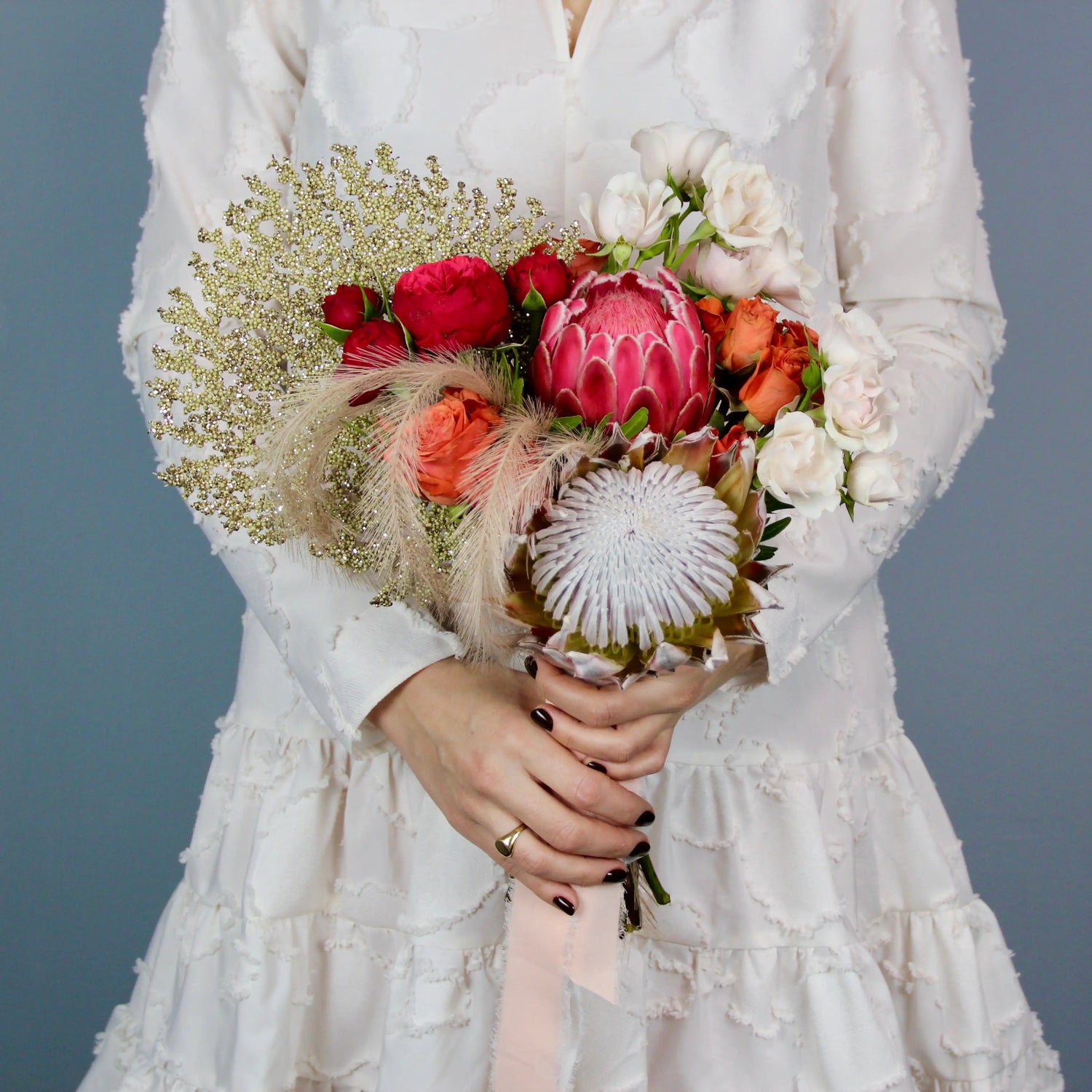 flower arrangement out of red, orange and white flowers