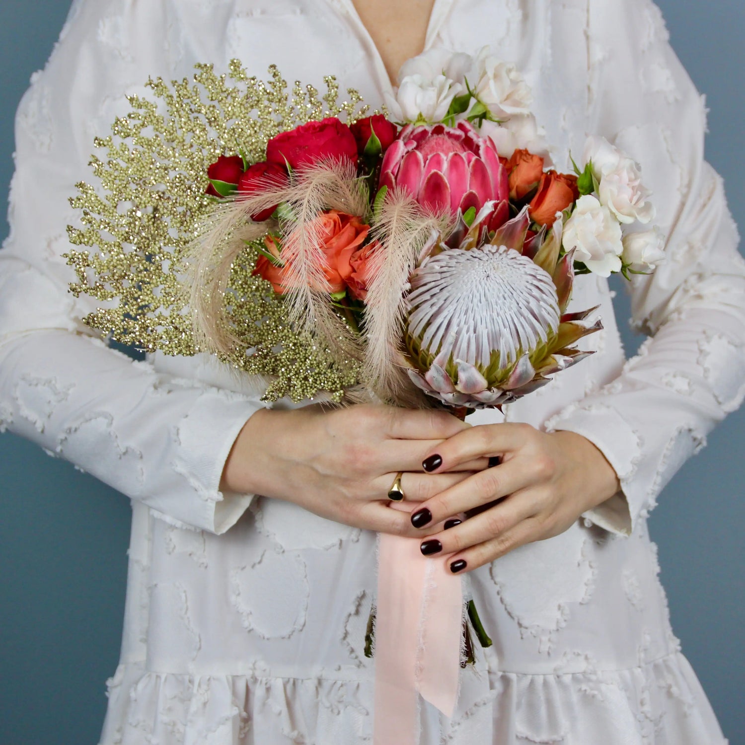 flower arrangement out of red, orange and white flowers