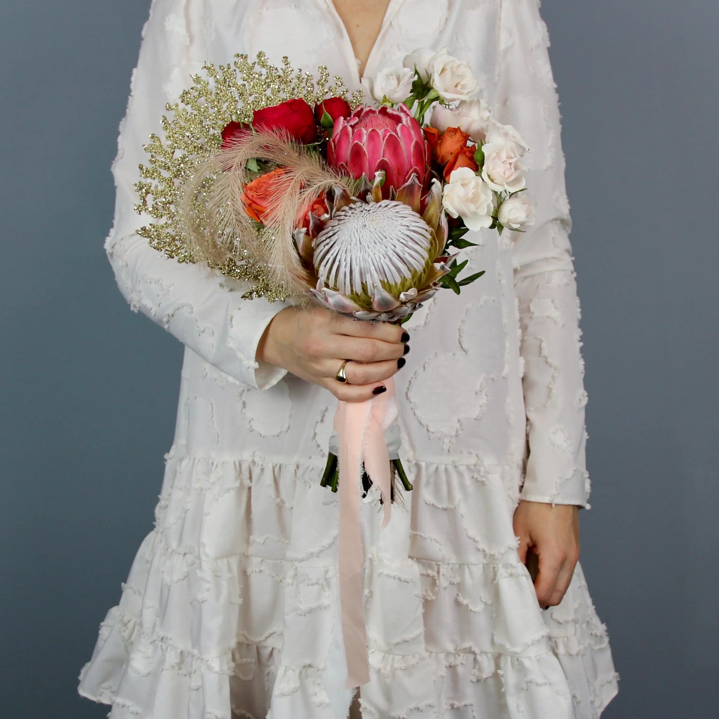 flower arrangement out of red, orange and white flowers
