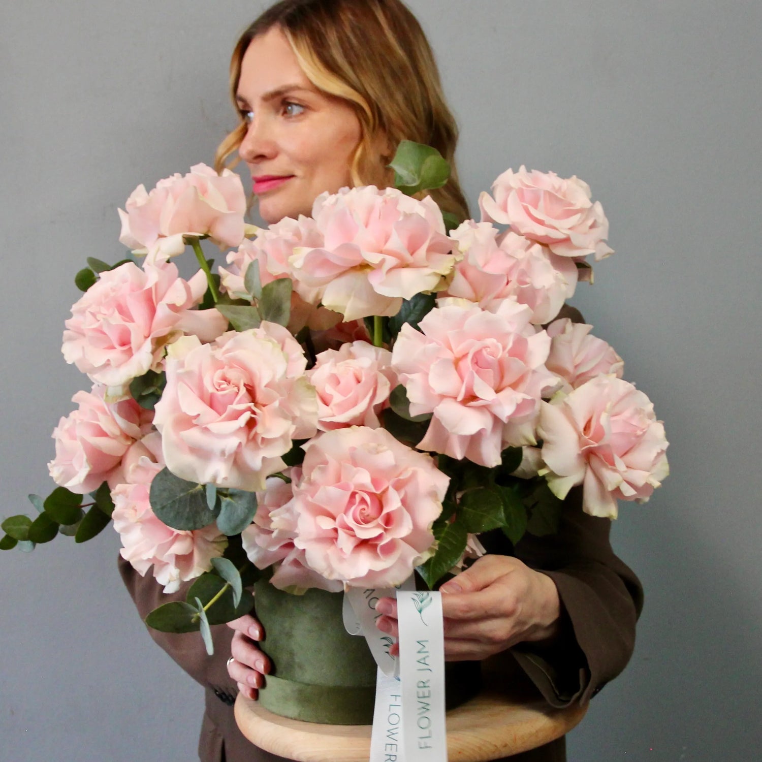 pink roses in a green box