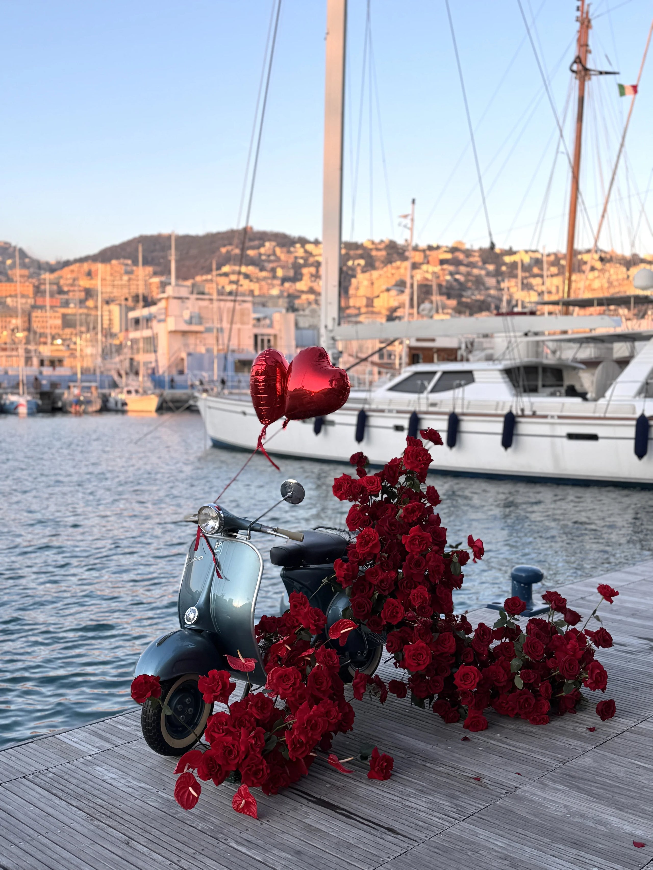 Vespa with red roses