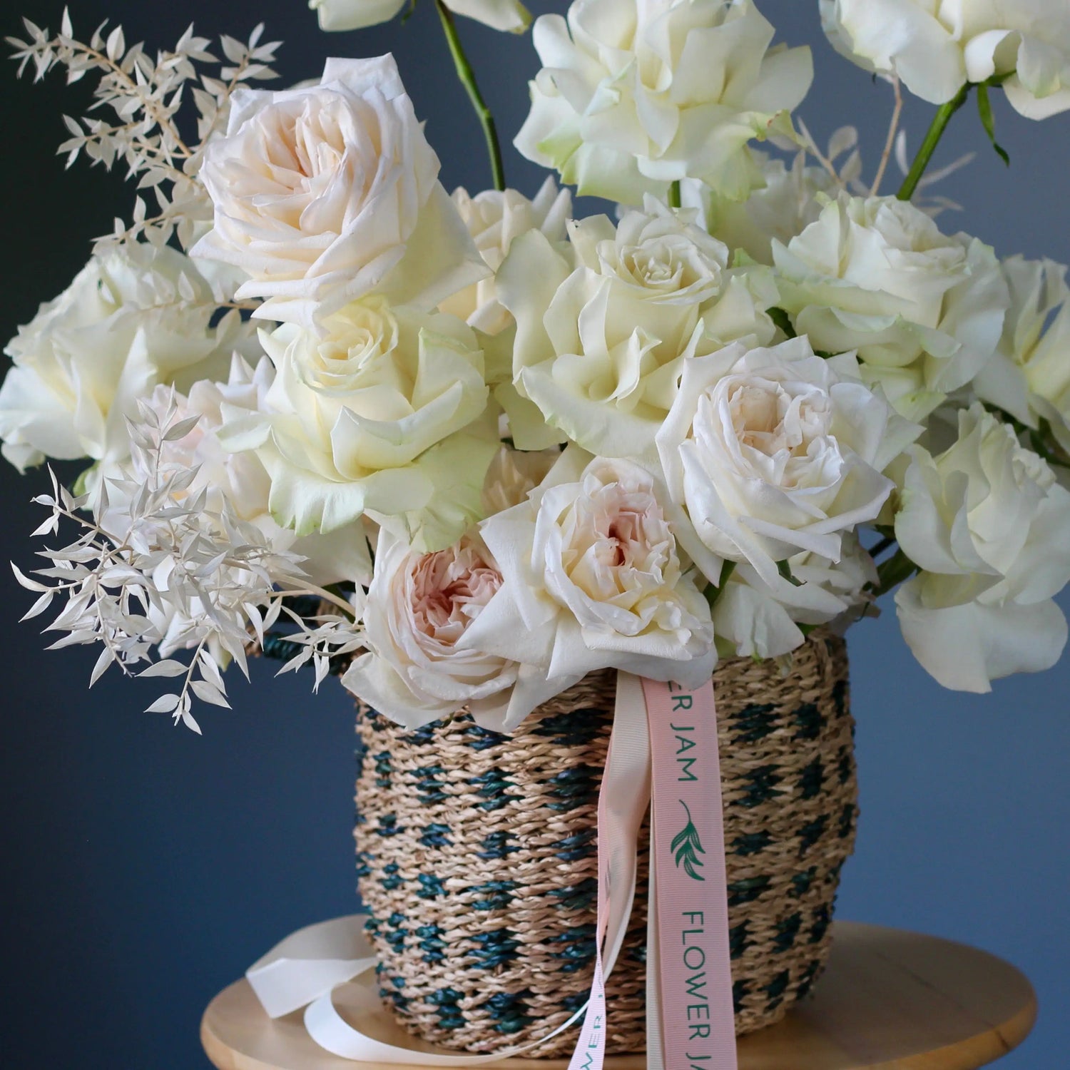 white roses in the basket genova  FLOWERS IN A BOX